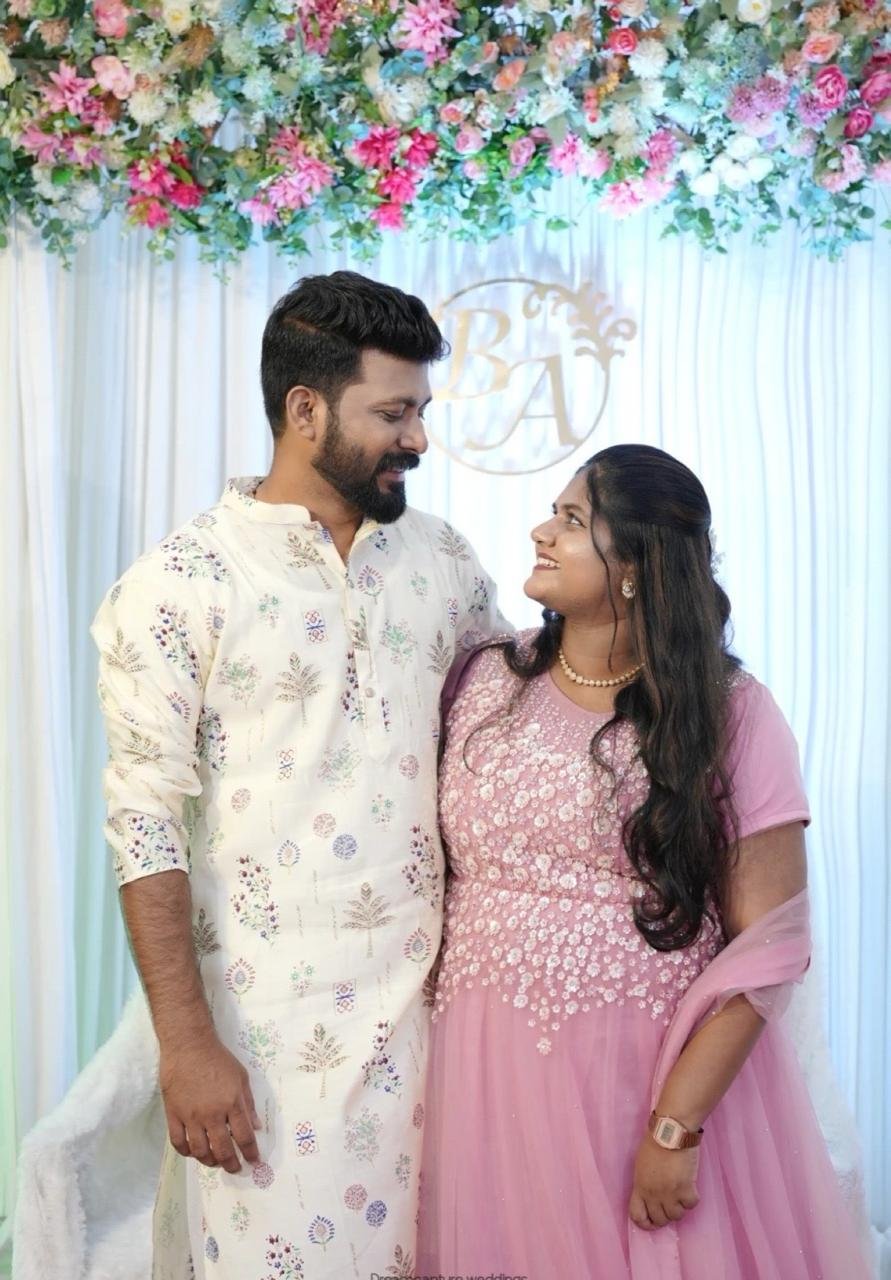 Bibin and Alicia smiling at each other at their engagement